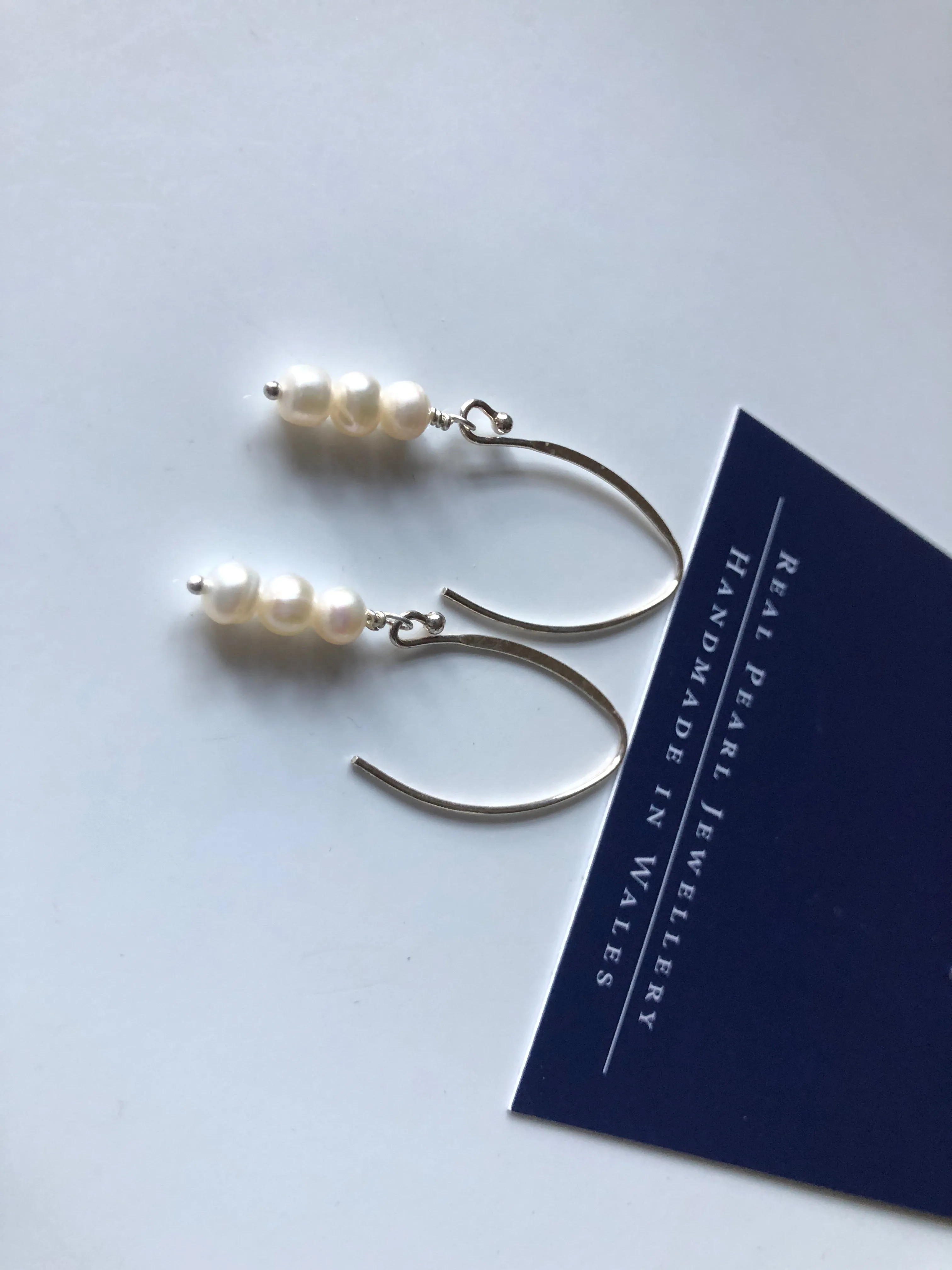 Earrings: Long triple drop Pearl ivory earrings on flat side hooks