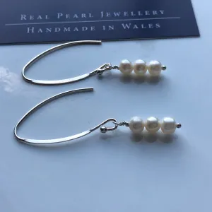 Earrings: Long triple drop Pearl ivory earrings on flat side hooks