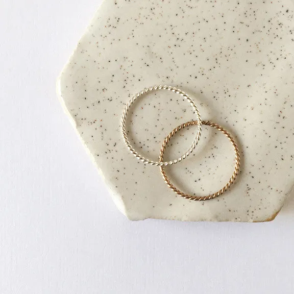 Twisted Stacking Rings